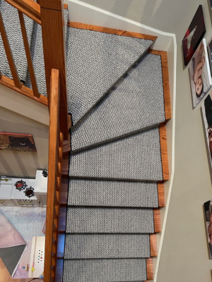 Black and white patterned stair runner from above stairs