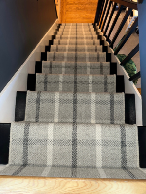 Grey and white plaid stair runner carpet.