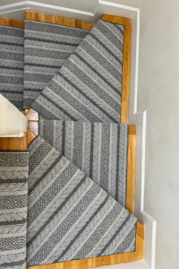Blue and white stair runner from above